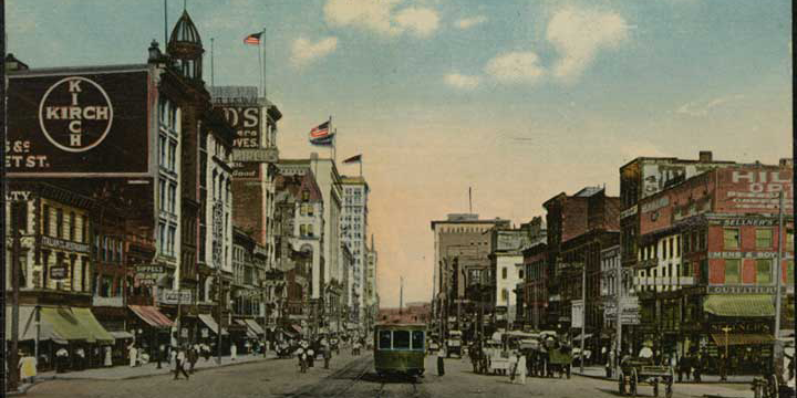Old postcard of Market Street in Newark looking East with buildings and trolley.